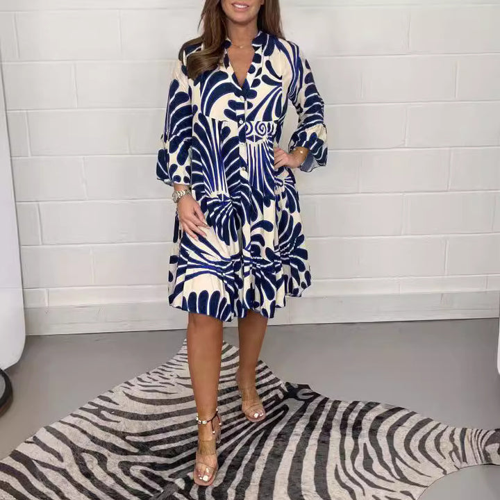 Women's tiered dress with large leaf print, V-neck and three-quarter sleeves Mune Fashion