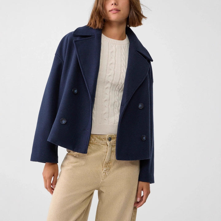Women’s short cut double-breasted wool blend peacoat with wide lapels and boxy silhouette Mune Fashion