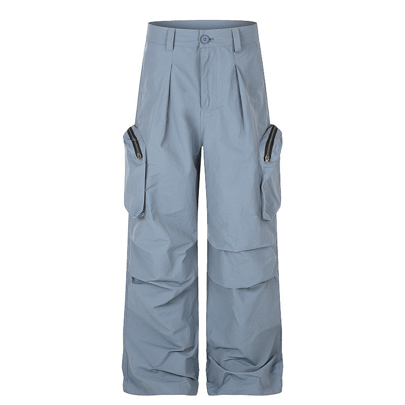 Women wide-cut cargo palazzo pants with high waist, zip pockets and layered panels Mune Fashion