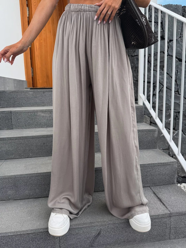 Women wide-cut Palazzo pants with high elastic waistband and flowing jersey Mune Fashion