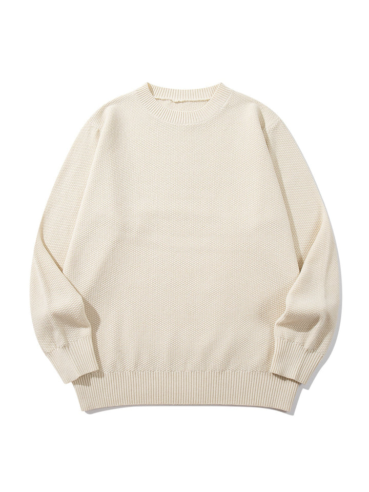 Unisex chunky knit round neck sweater with textured purl stitch and ribbed cuffs