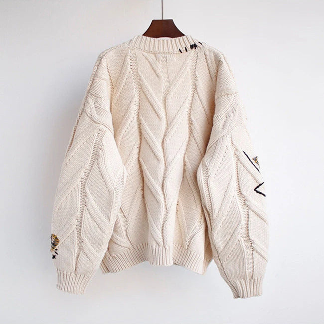 Women's fashionable knitted cardigan with colorful buttons and elaborate details