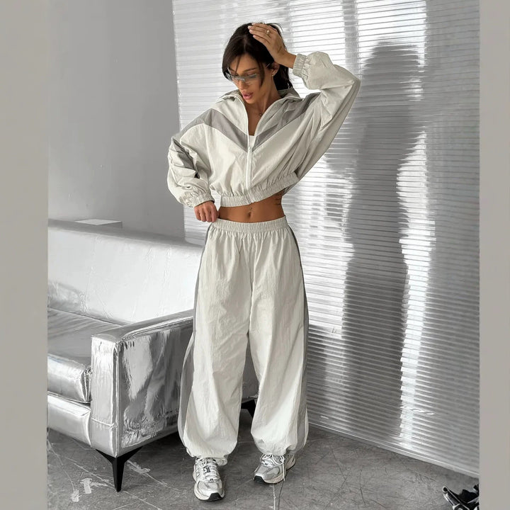 Women's satin track set with stand-up collar, chevron stripes and drawstring Mune Fashion