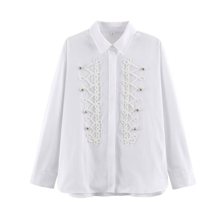 Women's blouse with long sleeves and decorative frog jewelry as well as concealed button placket