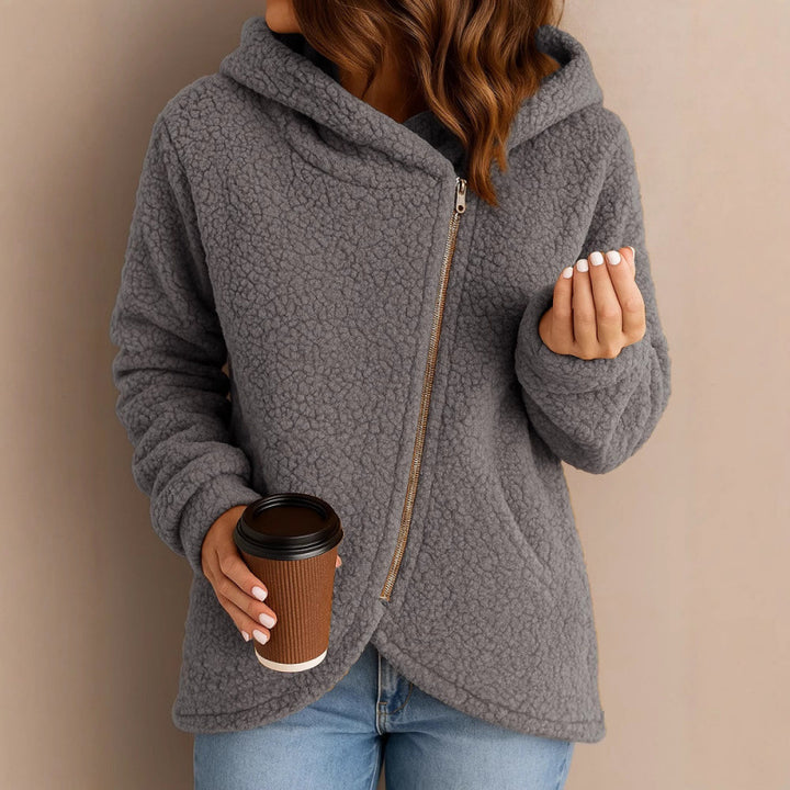 Women's teddy fleece jacket with asymmetrical zipper, hood and curved hem Mune Fashion