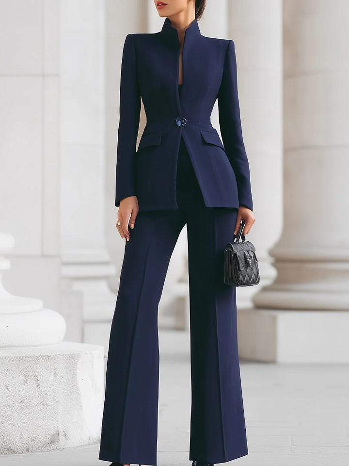 Women tailored suit with stand-up collar, fitted peplum and flared trousers Mune Fashion