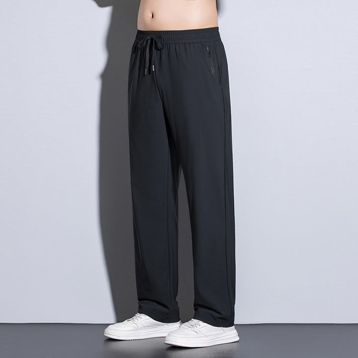 Men's sporty training pants with elastic waistband and practical pockets Mune Fashion