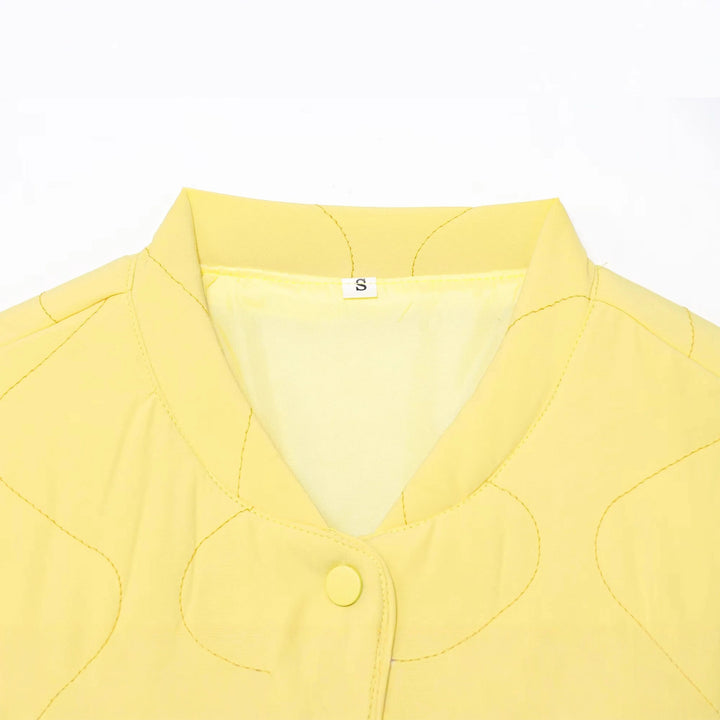 Women's quilted transitional jacket with wave stitching, V-neck and snap button placket Mune Fashion