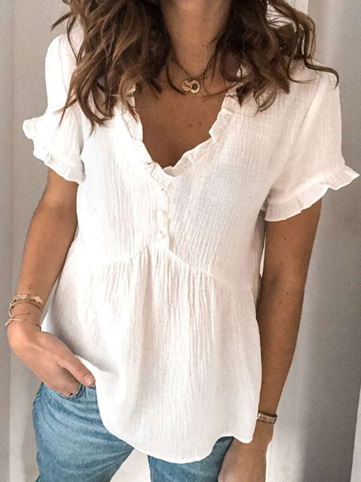 Ladies V-neck blouse with ruffle details and button closure Mune Fashion