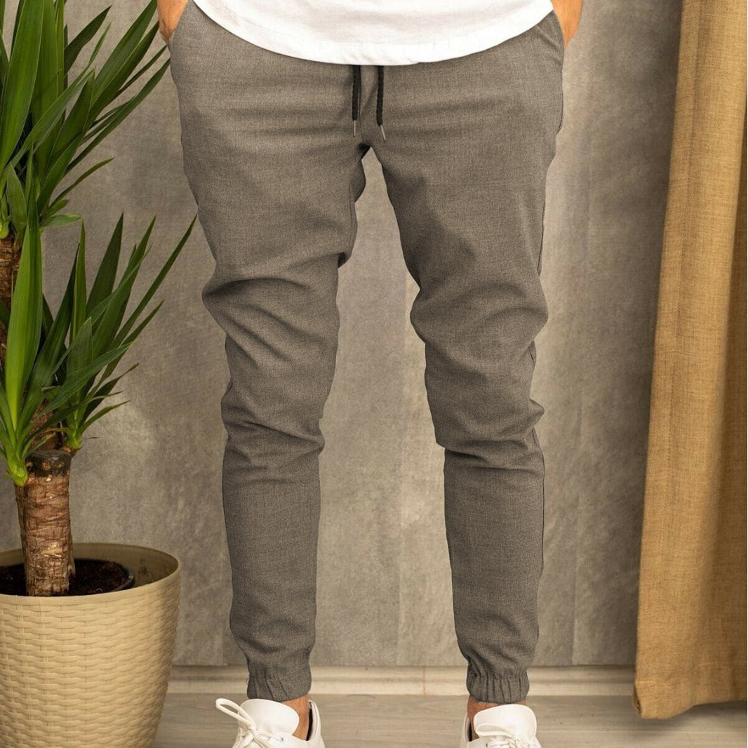 Men's slim fit jogging pants with elastic waistband, drawstring, and ribbed ankle cuff Mune Fashion