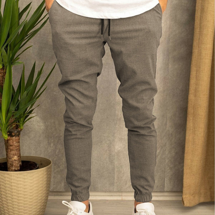 Men's slim fit jogging pants with elastic waistband, drawstring, and ribbed ankle cuff Mune Fashion