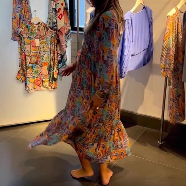 Women's tiered maxi dress in boho style with paisley print, V-neck, gathered empire waist and elastic cuffs Mune Fashion
