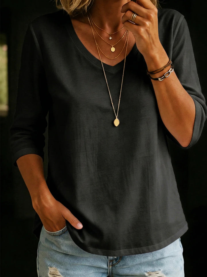Women's Loose V-Neck Shirt with 3/4 Sleeves and Rounded Hem Mune Fashion