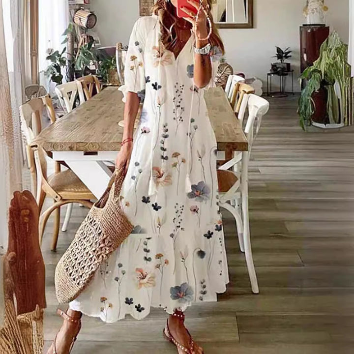 Women’s airy maxi dress in A-line with V-neck, casual rolled sleeves and floral all-over print Mune Fashion