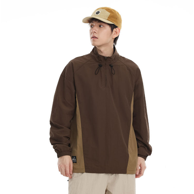 Men's lightweight nylon anorak with half-zip, drawstring hem, and raglan sleeves Mune Fashion
