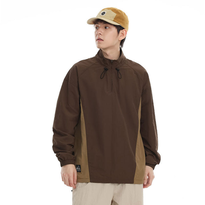 Men's lightweight nylon anorak with half-zip, drawstring hem, and raglan sleeves Mune Fashion