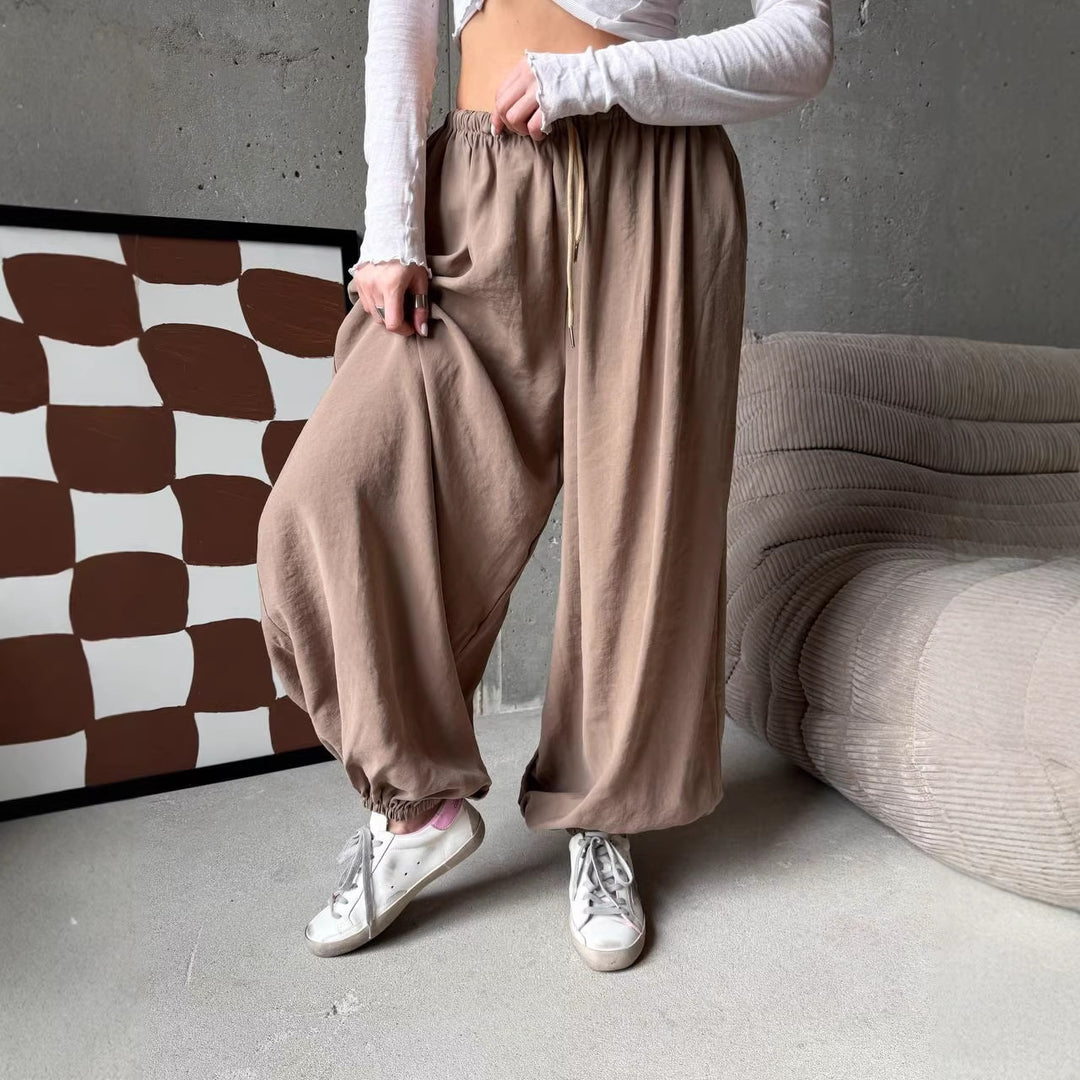 Women's wide harem balloon pants with high elastic waistband, drawstring, and casual wide fit.