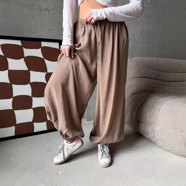 Women's wide harem balloon pants with high elastic waistband, drawstring, and casual wide fit.