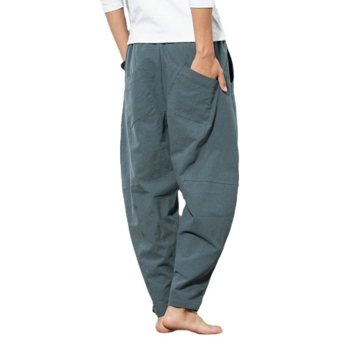 Men's loose harem pants made of cotton blend with elastic waistband, drawstring and side pockets Mune Fashion