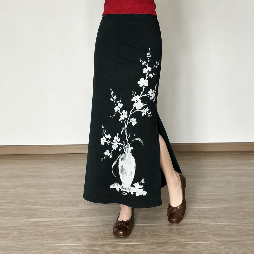 Women's flared maxi skirt with A-line cut, elastic waistband, and floral watercolor vase print Mune Fashion