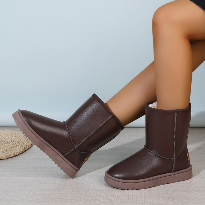 Women's winter boots with teddy lining, leather look and flat platform sole Mune Fashion