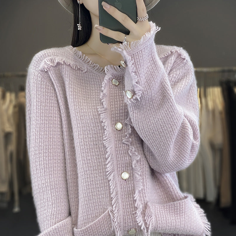 Women's knitted cardigan with fringe trim, mother-of-pearl button placket, and patch pockets Mune Fashion