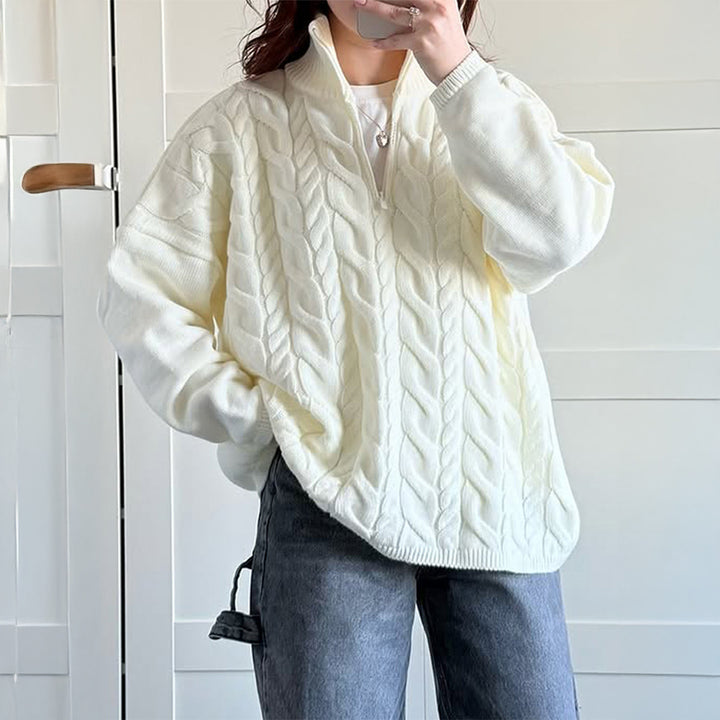 Women's oversized cable knit turtleneck sweater with half zip, high stand-up collar, and rounded hem Mune Fashion