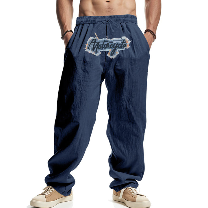 Men's loosely fitting linen look relax pants with elastic waistband, drawstring & front print Mune Fashion