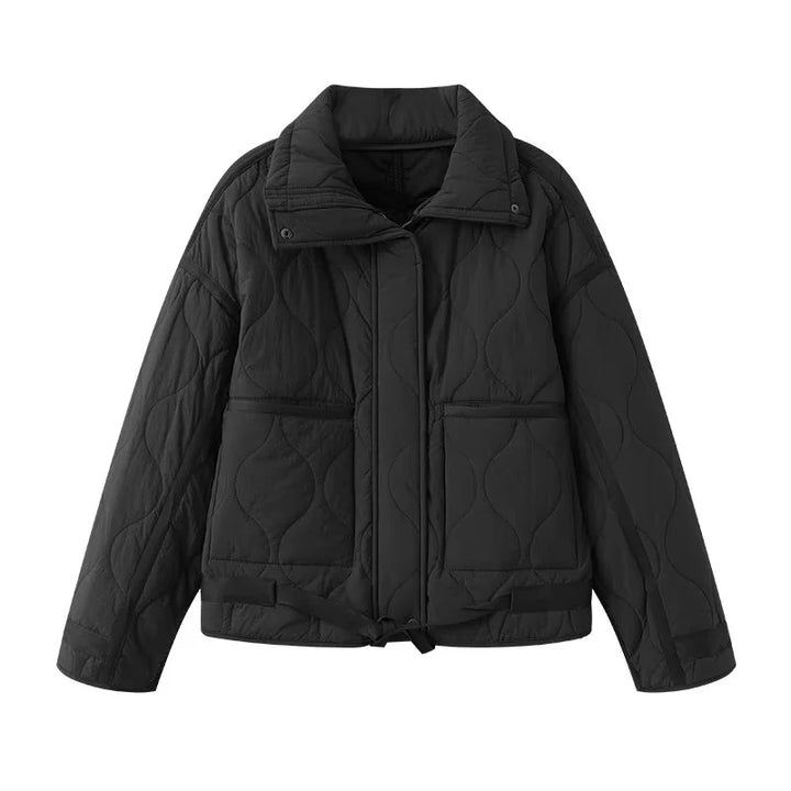 Women's quilted boxy transitional jacket with drawstring hem, stand-up collar, and patch pockets Mune Fashion