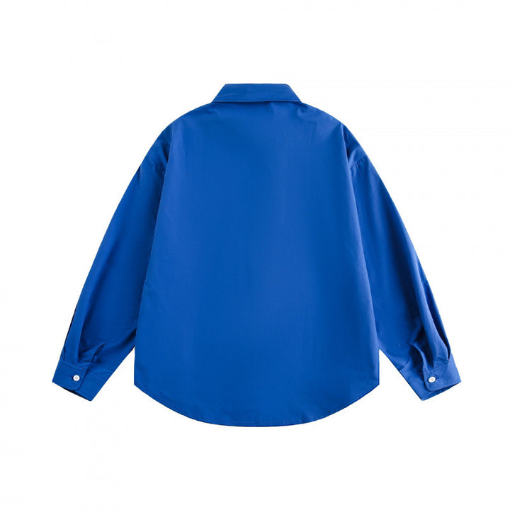 Unisex Loose-fitting oversized shirt made of cotton blend with Kent collar, chest pocket, and rounded hem Mune Fashion