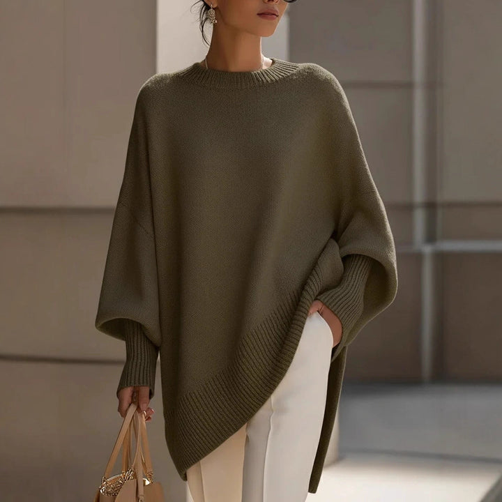 Women's oversized knit poncho with asymmetrical hem and ribbed sleeves Mune Fashion