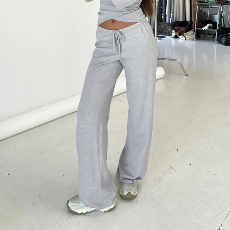 Women's wrap cropped top with deep V-neck, fitted wrap shape, and long bell sleeves Mune Fashion