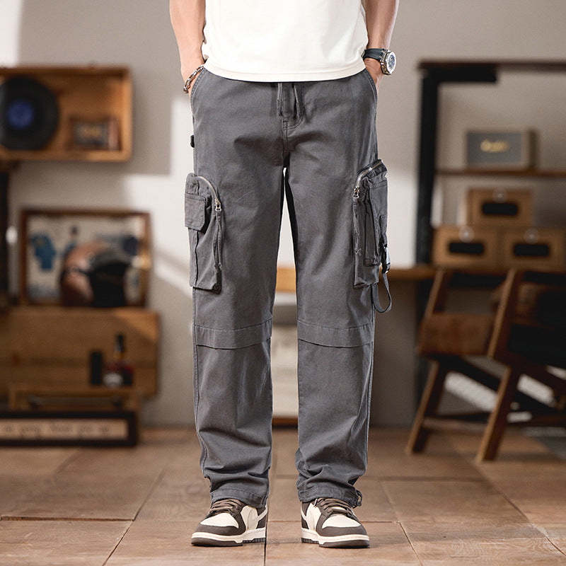 Men's multifunctional cargo pants in utility style with large flap and zip pockets, drawstring closure, and sturdy twill Mune Fashion