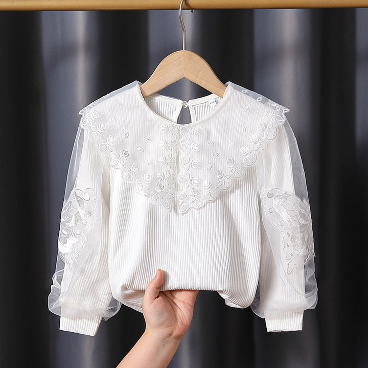 Girl's blouse with transparent puff sleeves and floral lace trim Mune Fashion