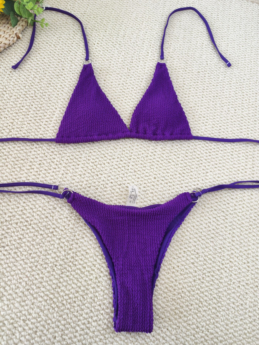 Women's triangle bikini with textured fabric and elegant ring embellishments Mune Fashion