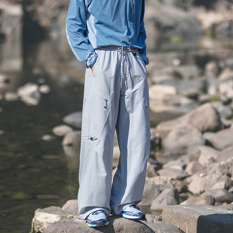 Men's loose technical cargo pants with drawstring, zipper pockets, and adjustable hem Mune Fashion