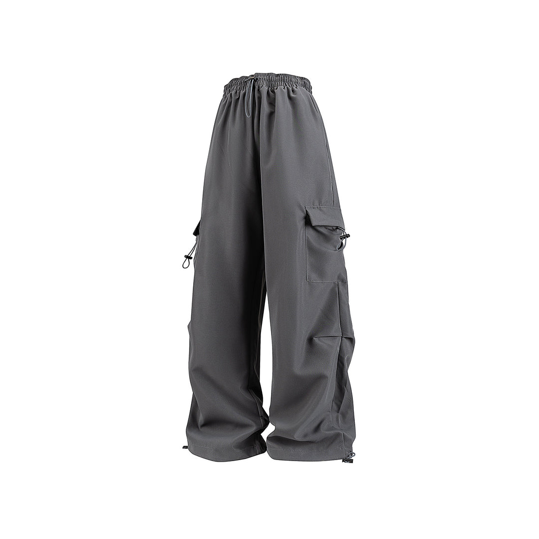Men's wide technical cargo pants with drawstring waistband, multiple pockets and corded closure Drune