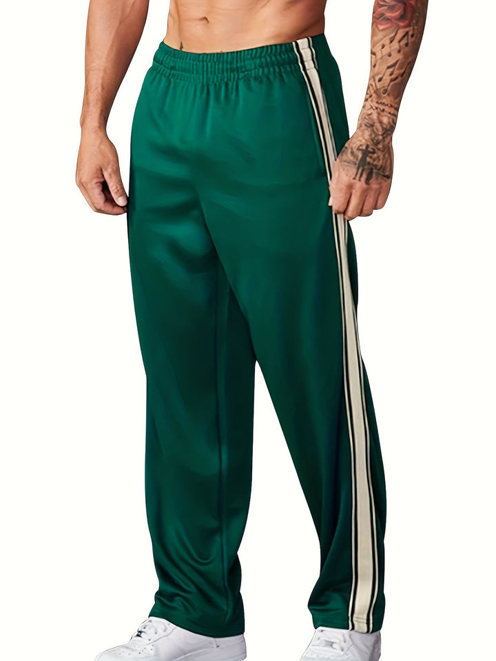 Men's sporty training pants with side tape stripes and elastic waistband Mune Fashion