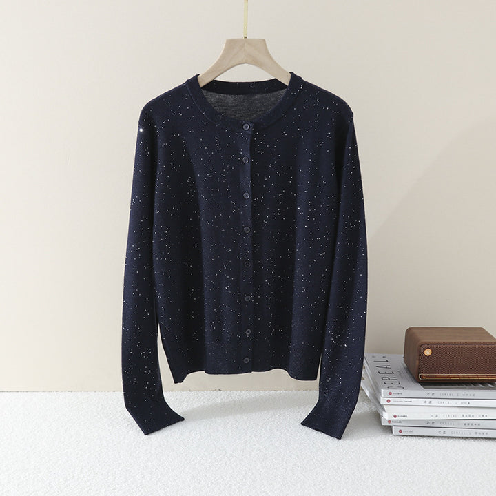 Women's fine round neck cardigan made of lightweight fine knit with pearl button placket and subtle glitter effect.