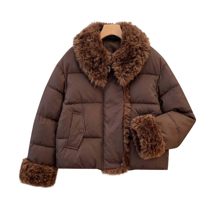 Women's fitted quilted jacket with voluminous teddy collar and detachable pom-pom details Mune Fashion