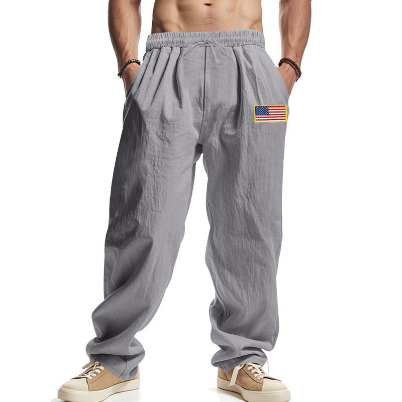 Men's loose-fitting leisure pants in linen look with elastic waist, drawstring & flag patch Mune Fashion