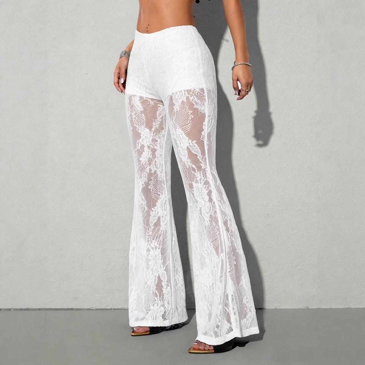 Women high-waisted lace flared pants with opaque inner shorts and floral transparent inserts Mune Fashion