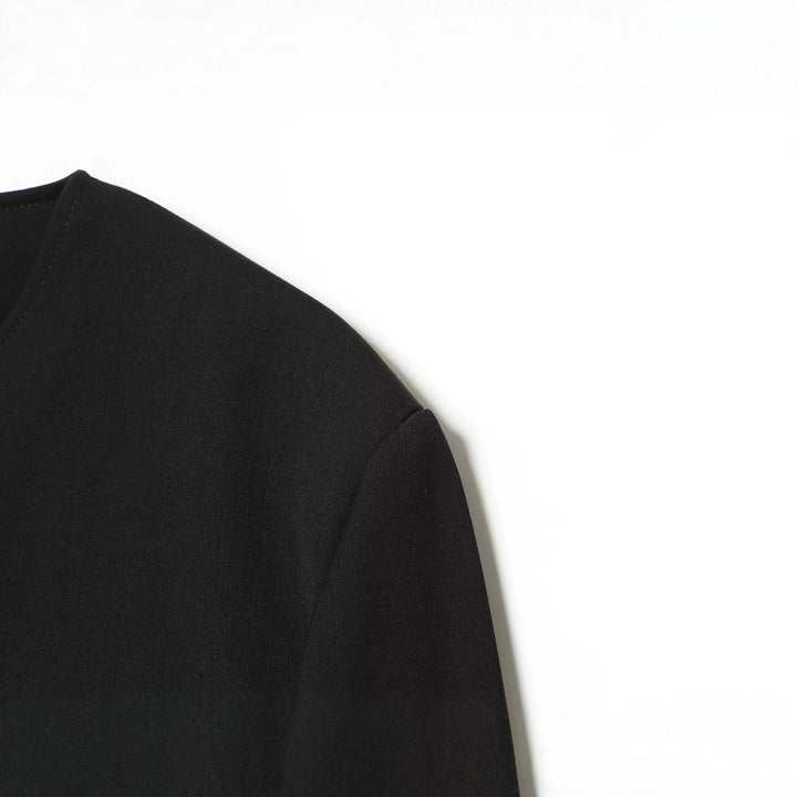 Women's short utility-style jacket with waist belt, patch pockets, and round neckline Drune