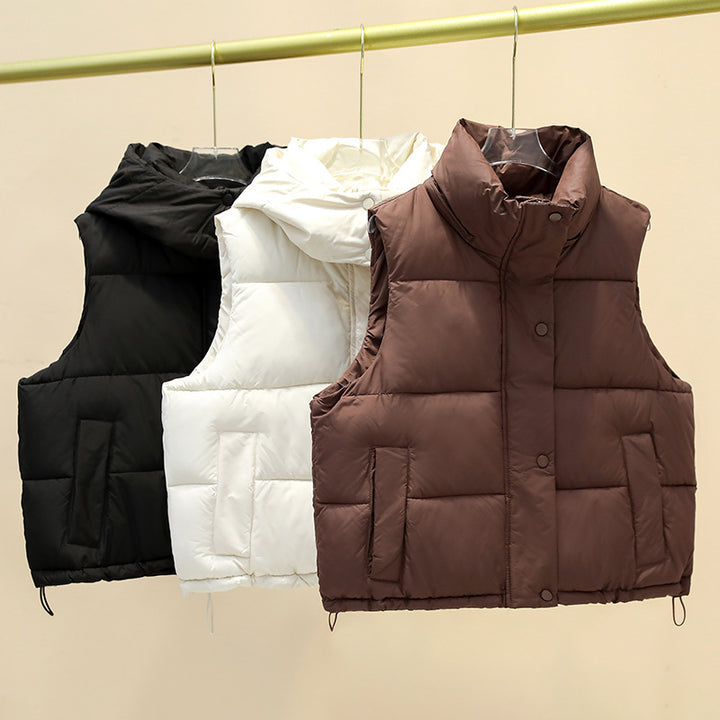 Women’s short quilted vest with voluminous stand-up collar, snap button placket, and adjustable drawstring hem Mune Fashion