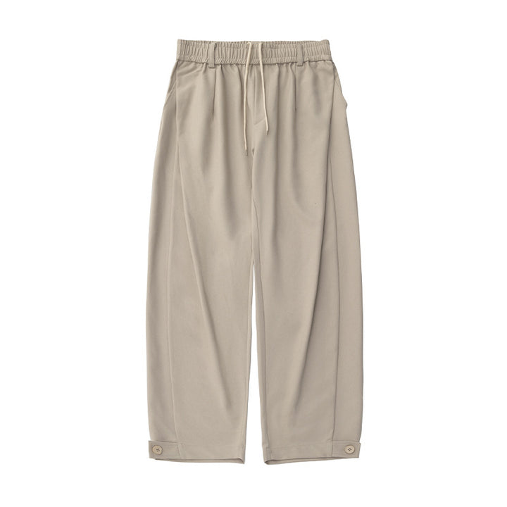 Women's wide pleat trousers with elastic waistband, drawstring and buttoned cuff Mune Fashion