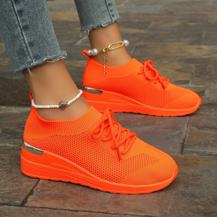 Women’s knit sneakers with wedge sole, sock-like shaft and metallic heel accent Mune Fashion
