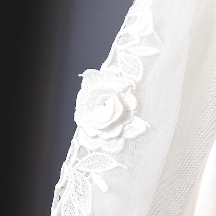Girl's blouse with floral embroidery and transparent sleeves Mune Fashion
