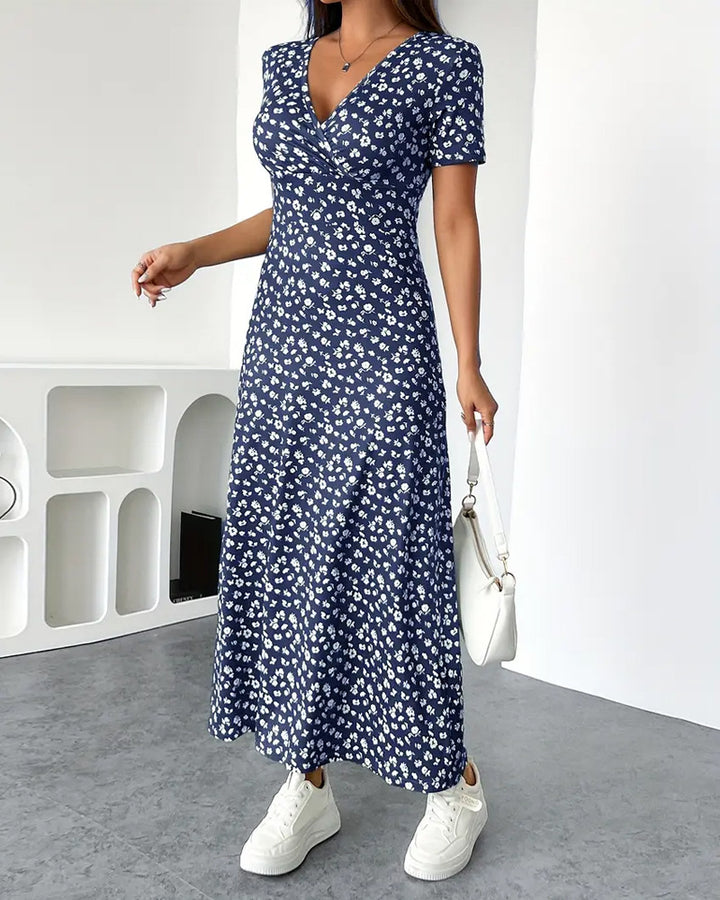 Women's fitted jersey midi dress with crossover top, short sleeves, and flared skirt Mune Fashion