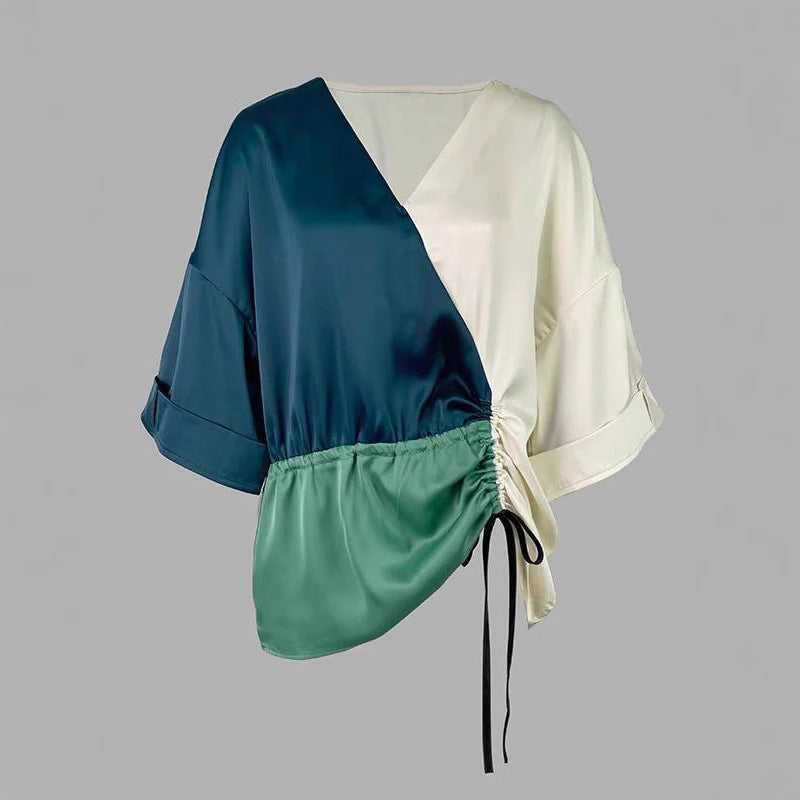 Women's blouse with V-neckline and side gathering cord