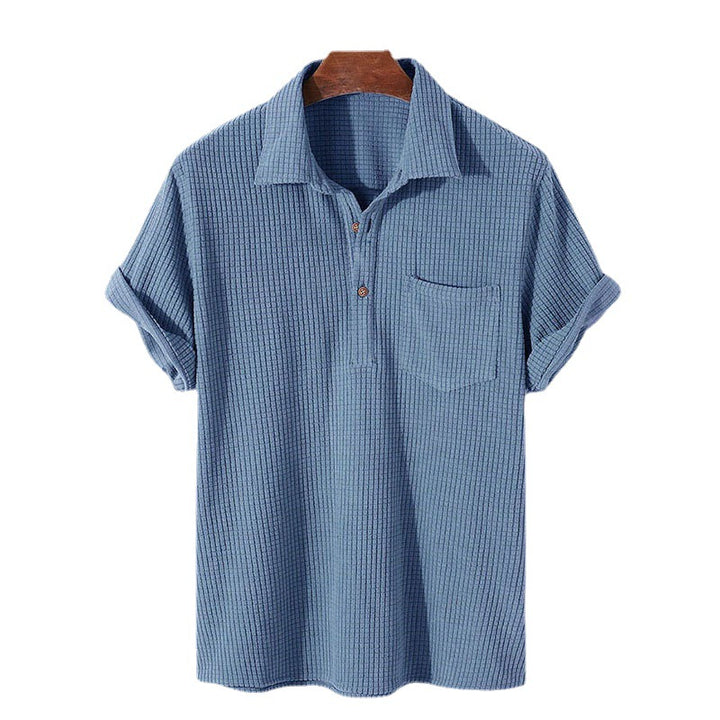 Men's waffle knit polo with shirt collar, short button placket and chest pocket Mune Fashion